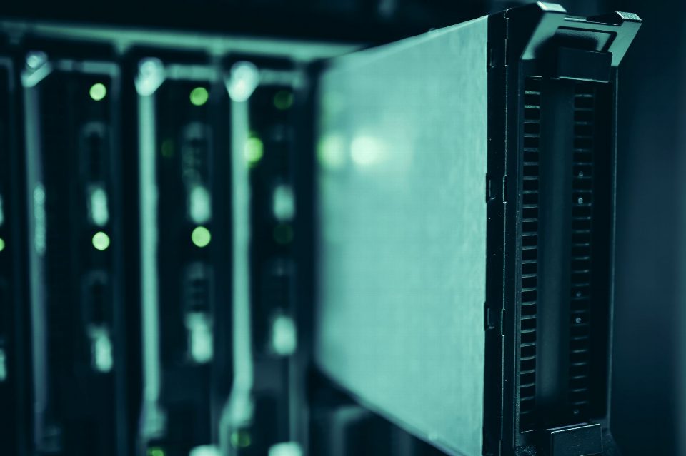 Close-up of server racks in a data center highlighting modern technology infrastructure. Close-up of server racks in a data center highlighting modern technology infrastructure.