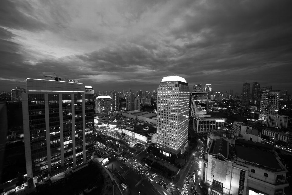 Aerial view of Jakarta's skyline at night showcasing iconic skyscrapers in black and white. Aerial view of Jakarta's skyline at night showcasing iconic skyscrapers in black and white.