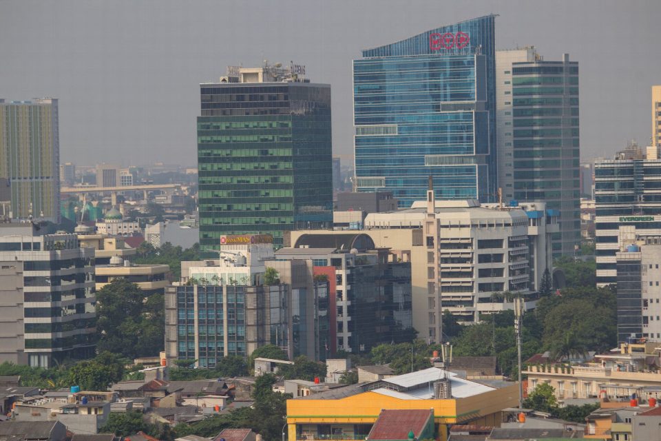 Aerial view of Jakarta's urban skyline showcasing modern skyscrapers and bustling city life. Aerial view of Jakarta's urban skyline showcasing modern skyscrapers and bustling city life.